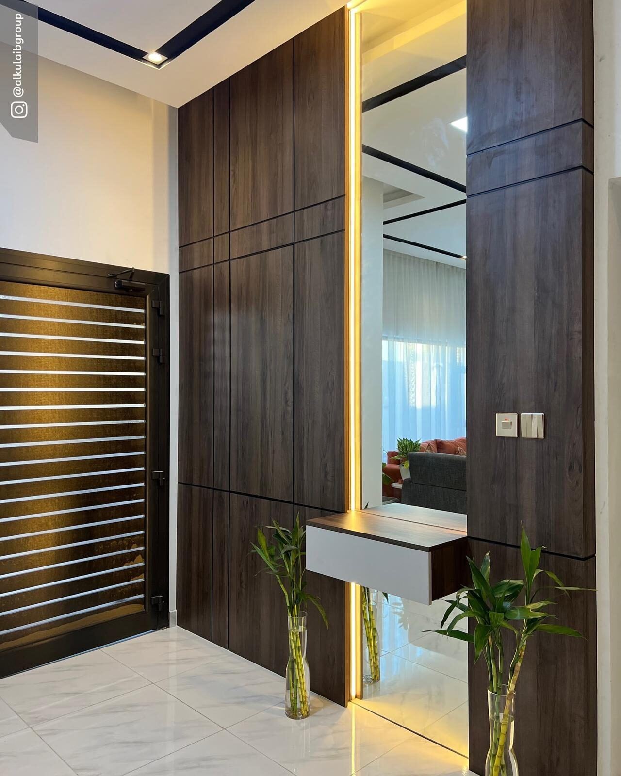 Bespoke wooden entrance and feature wall by Alkulaib Group carpentry, Bahrain
